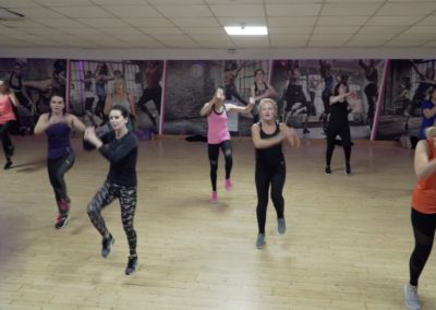 women in a class in the hearts studio